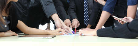 Business People Analyzing Statistics Financial Concept or Business People Meeting Conference Discussion Corporate Concept or Teamwork with business people analysis cost graph on desk at meeting room.の写真素材
