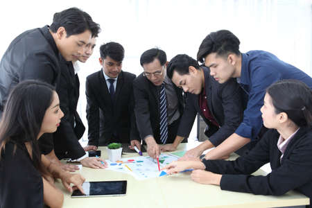 Business People Analyzing Statistics Financial Concept or Business People Meeting Conference Discussion Corporate Concept or Teamwork with business people analysis cost graph on desk at meeting room.の写真素材