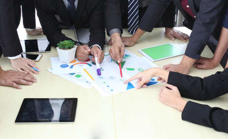 Business People Analyzing Statistics Financial Concept or Business People Meeting Conference Discussion Corporate Concept or Teamwork with business people analysis cost graph on desk at meeting room.の写真素材
