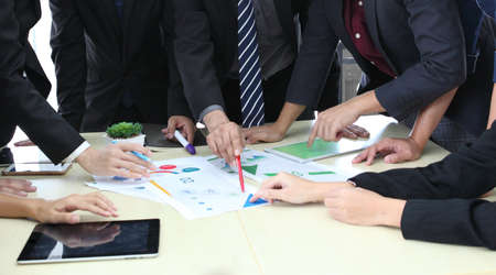 Business People Analyzing Statistics Financial Concept or Business People Meeting Conference Discussion Corporate Concept or Teamwork with business people analysis cost graph on desk at meeting room.の写真素材