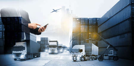 Double exposure of delivery industry and logistics concept container truck ,ship in port and freight cargo plane in transport and import-export commercial logistic ,blue toneの写真素材