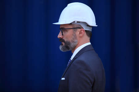 businessman he is working in container box yard area of  logistics transportation import export or shipping industryの写真素材