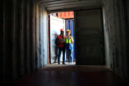 African American  black engineer they are working in container box yard area of  logistics transportation import export or shipping industryの写真素材