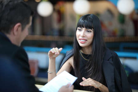 Businesswoman and businessman HR manager interviewing woman. Candidate female sitting interviewers on background. Human resources,Young attractive woman during job interviewの写真素材