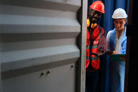 logistics background for delivery business or transportion industry, engineer working in container area  logistics transportation import export or shipping industry free-zone areaの写真素材