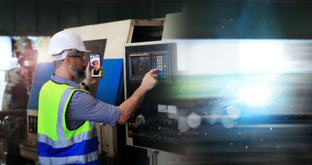 Engineer holding smartphone using vdo call  internet technology , Engineer control and inspection...
