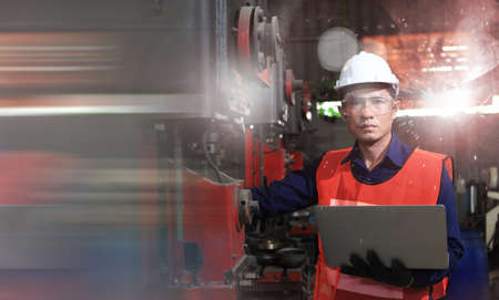 engineer on site working for production or maintenance  big machine industry in factory