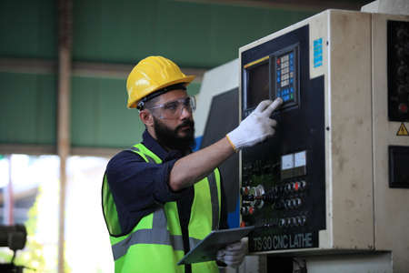 engineer on site working for production or maintenance  big machine industry in factory