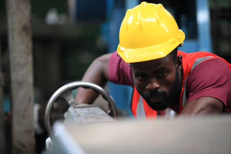 African American engineer skills quality, maintenance, training industry factory worker , warehouse Workshop for factory operators, mechanical engineering team production.の写真素材