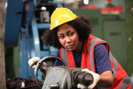 African American engineer skills quality, maintenance, training industry factory worker , warehouse Workshop for factory operators, mechanical engineering team production.の写真素材