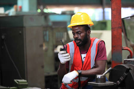 African American engineer skills quality, maintenance, training industry factory worker , warehouse Workshop for factory operators, mechanical engineering team production.の写真素材