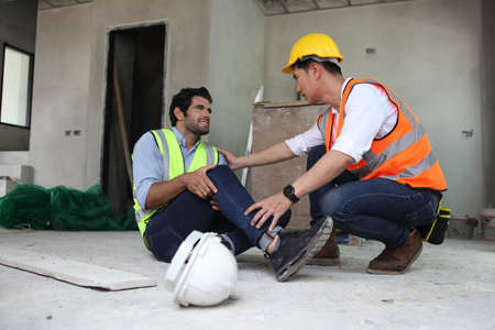 engineering team or worker team they are working at construction site and he accidentの写真素材