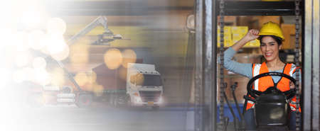 female driving forklift or Woman warehouse worker with forklift.worker in warehouse, Working at warehouse.International export business conceptの写真素材
