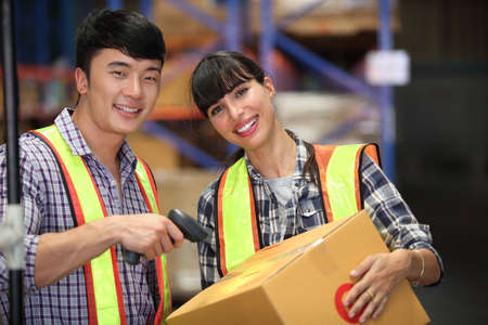 Portrait of people warehouse , they happy and  working at The Warehouse. Storehouse area, Shipment. ...