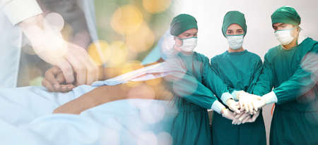 Medical team performing surgery. Group of surgeons in hospital operation theater. Doctor team  medical their successの写真素材