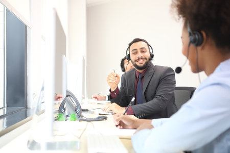 Successful business professionals. Happy attractive businessman Call center worker accompanied by...