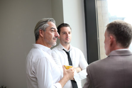 Successful business professionals team meeting  report while working together with colleagues in the modern office.の写真素材