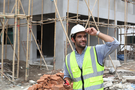 Construction engineer working on the construction site. To describe home design workの写真素材