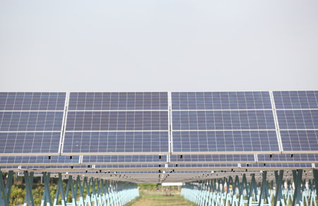 Solar Panels and Wind Turbines at Sunset or Sunrise.Concept of Renewable Energy , Solar cell farm...