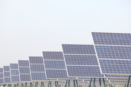 Solar Panels and Wind Turbines at Sunset or Sunrise.Concept of Renewable Energy , Solar cell farm...
