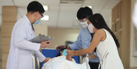emergency case sick person moving to ICU with doctor teamの写真素材