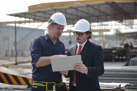 engineering team working on siteの写真素材