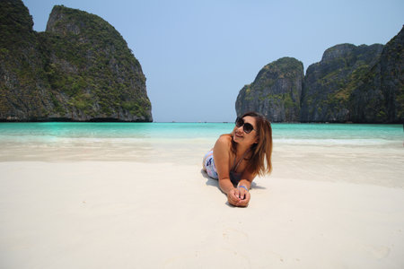 Happy traveler woman enjoys her tropical beach vacation , summer of vacationの写真素材