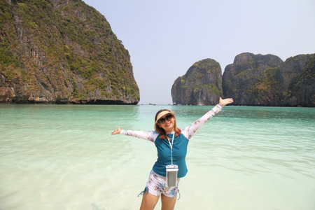 Happy traveler woman enjoys her tropical beach vacation , summer of vacationの写真素材