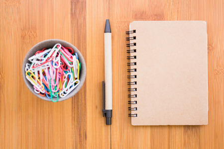 Vintage style of open notebook and pen on the old wooden floor.の写真素材