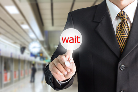 Businessman hand pointing on the screen, press the button, wait - can be used for editing text or image of your fingers.の写真素材