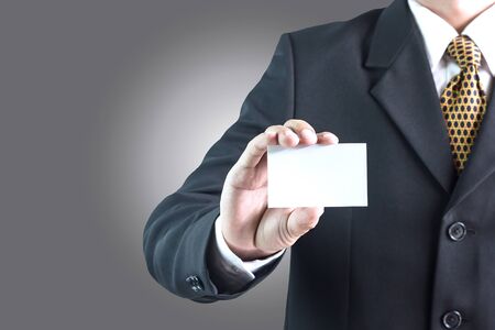 Asian businessman holding empty white cardの写真素材