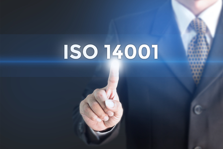 A Businessman holding a white sign with the message ISO 14001. Can bring to the medium of your ad.の写真素材