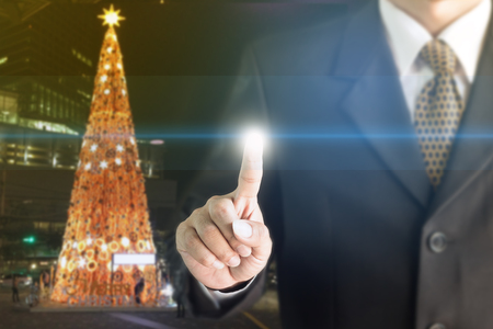 Businessman standing hand touch screen. You can add text to your ad.の写真素材