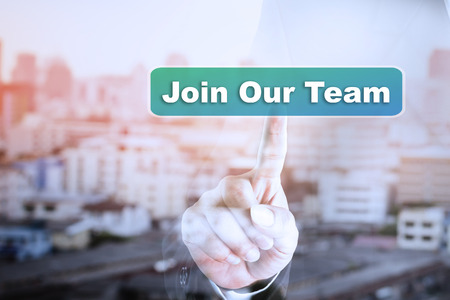 Businessman hand touch screen graph on Join Our Team. Can be used for your ad.の写真素材