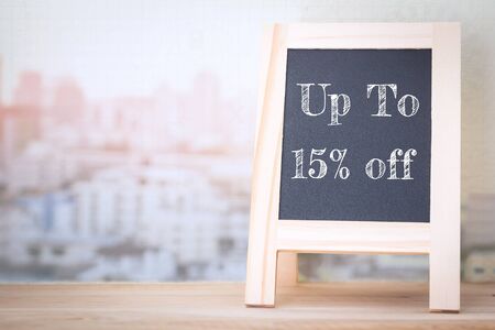 Concept up to 15% off message on wood boardsの写真素材