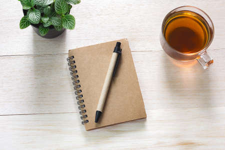 Book on table and cup of tea, You can enter textの写真素材