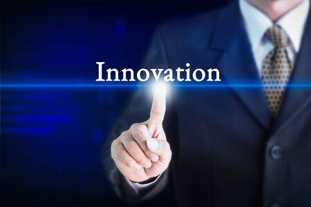 Businessman holding a white sign with the message Innovation. Can be used for your advertising.の写真素材