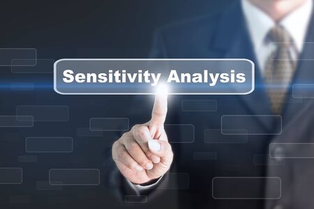 Businessman pressing a Sensitivity Analysis concept button. Can be used in advertising.の写真素材