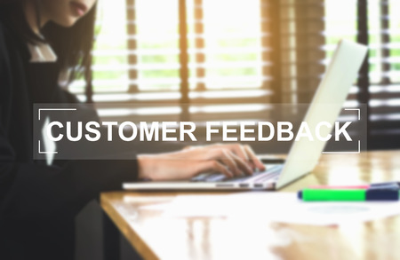 Concept Customer Feedback message on background women working. Vintage tone.の写真素材