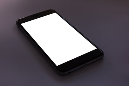 Smart phone on Black background. You can put in ads.の写真素材