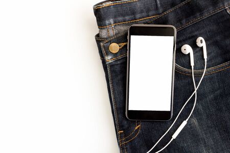 smartphone put on jeans and earphoneの写真素材