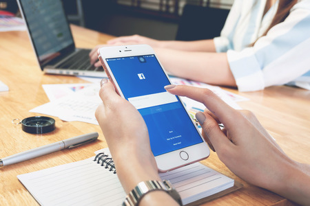 BANGKOK ,THAILAND - March 05, 2017 : Login Screen Facebook icons on Apple IPhone 6. largest and most popular social networking site in the world.のeditorial素材