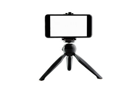 The phone is mounted on the stand of the device.の写真素材