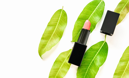 Multi colored lipstick arranged in rows on a white background.の写真素材