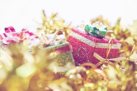 Gift Box with beautiful bow put on a gold tassel decorated for Christmas or New Year. Used for...