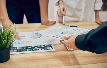 teamwork, Young businesswoman in office in casual shirt. Selecting information with colleagues with...