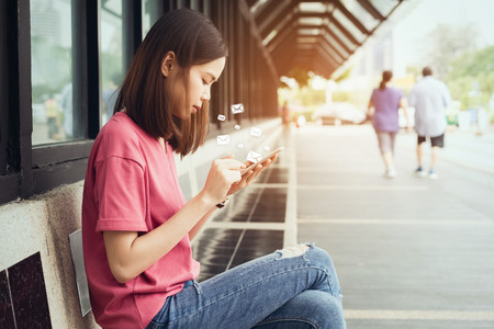 woman using smartphone and show icon social email, Concept of communication and working online.の写真素材
