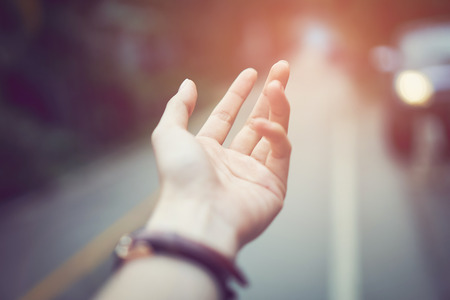 the hand touch dropping rain scattered down. Environmental concept.の写真素材