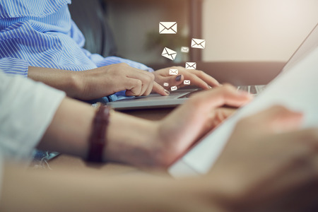 woman using laptop and show icon social email, Concept of communication and working online.の写真素材