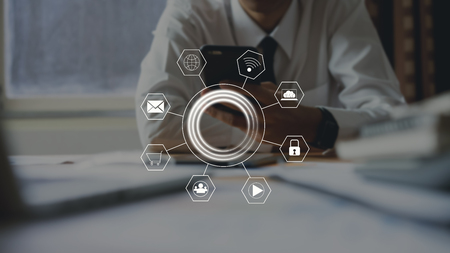 businessman using smartphone and show sign technology icon. Concept of future and trend internet for...